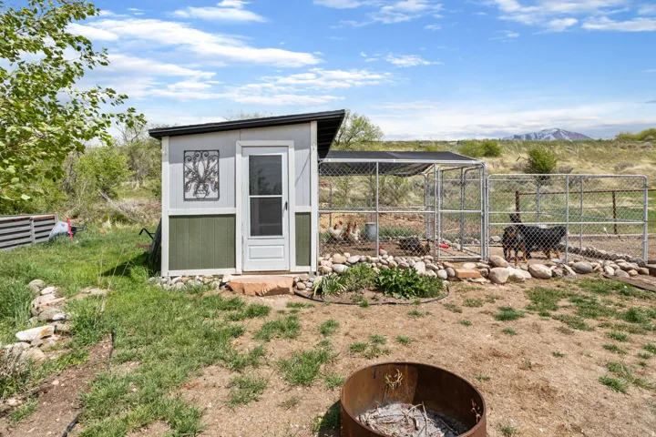 View of chicken coop with a mountain view