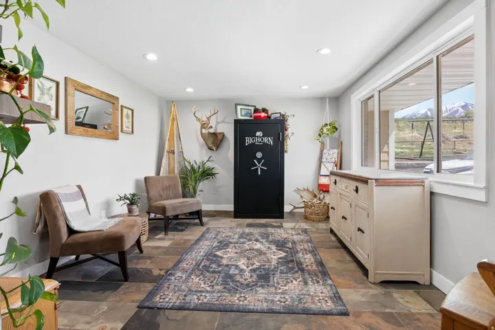 Sitting room featuring recessed lighting and stone tile flooring