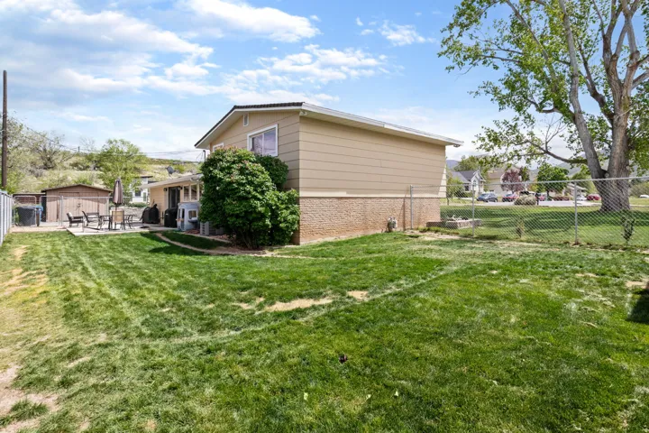 Fenced backyard featuring a patio