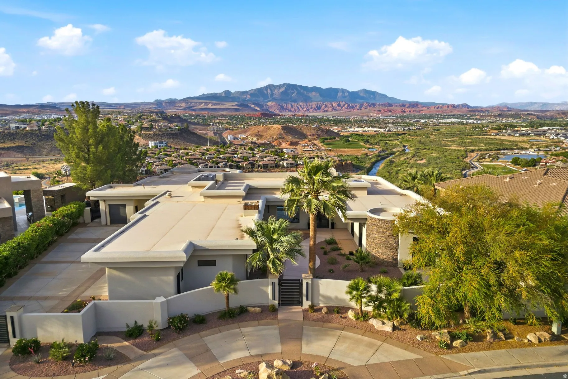 Aerial view of residential area featuring mountains