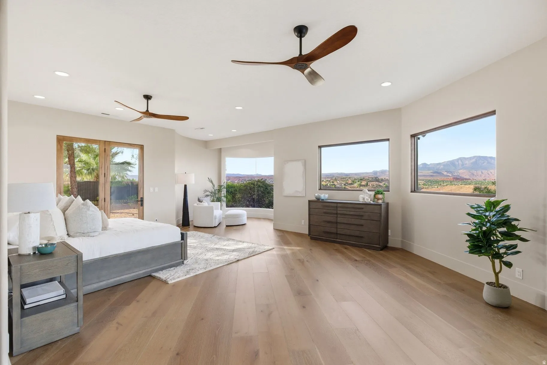Bedroom with light wood-style flooring, multiple windows, access to exterior, ceiling fan, and recessed lighting