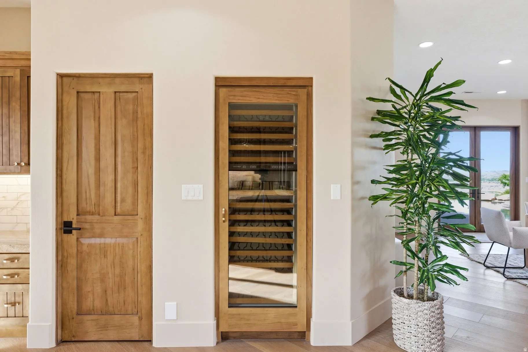 Detailed view of wood finished floors and recessed lighting