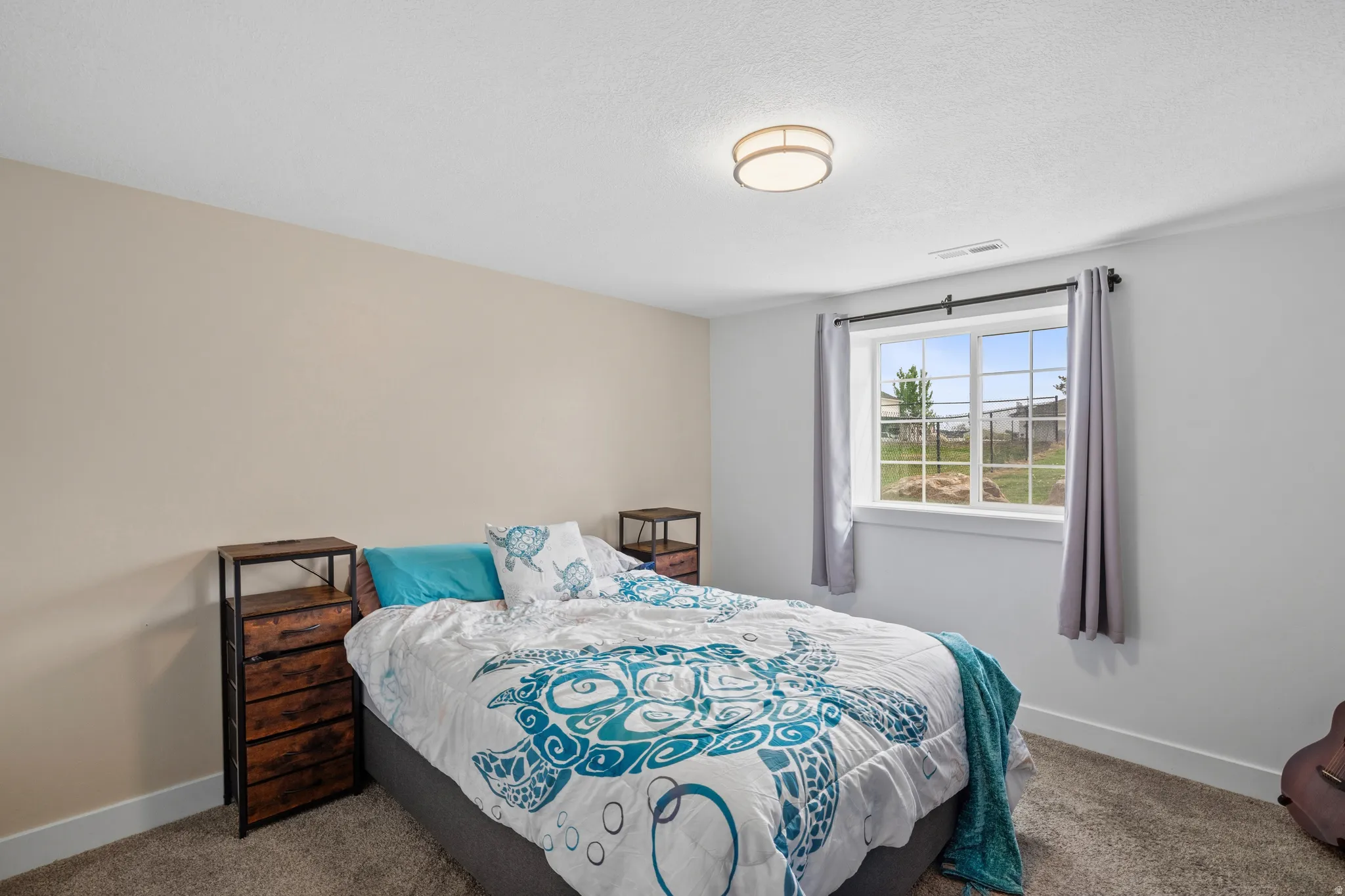 Carpeted bedroom with baseboards