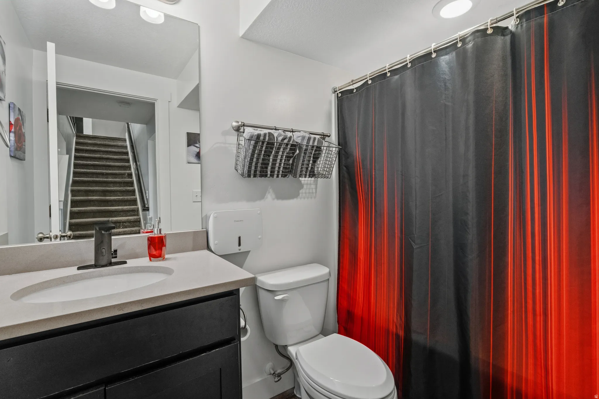 Bathroom featuring vanity and a shower with curtain