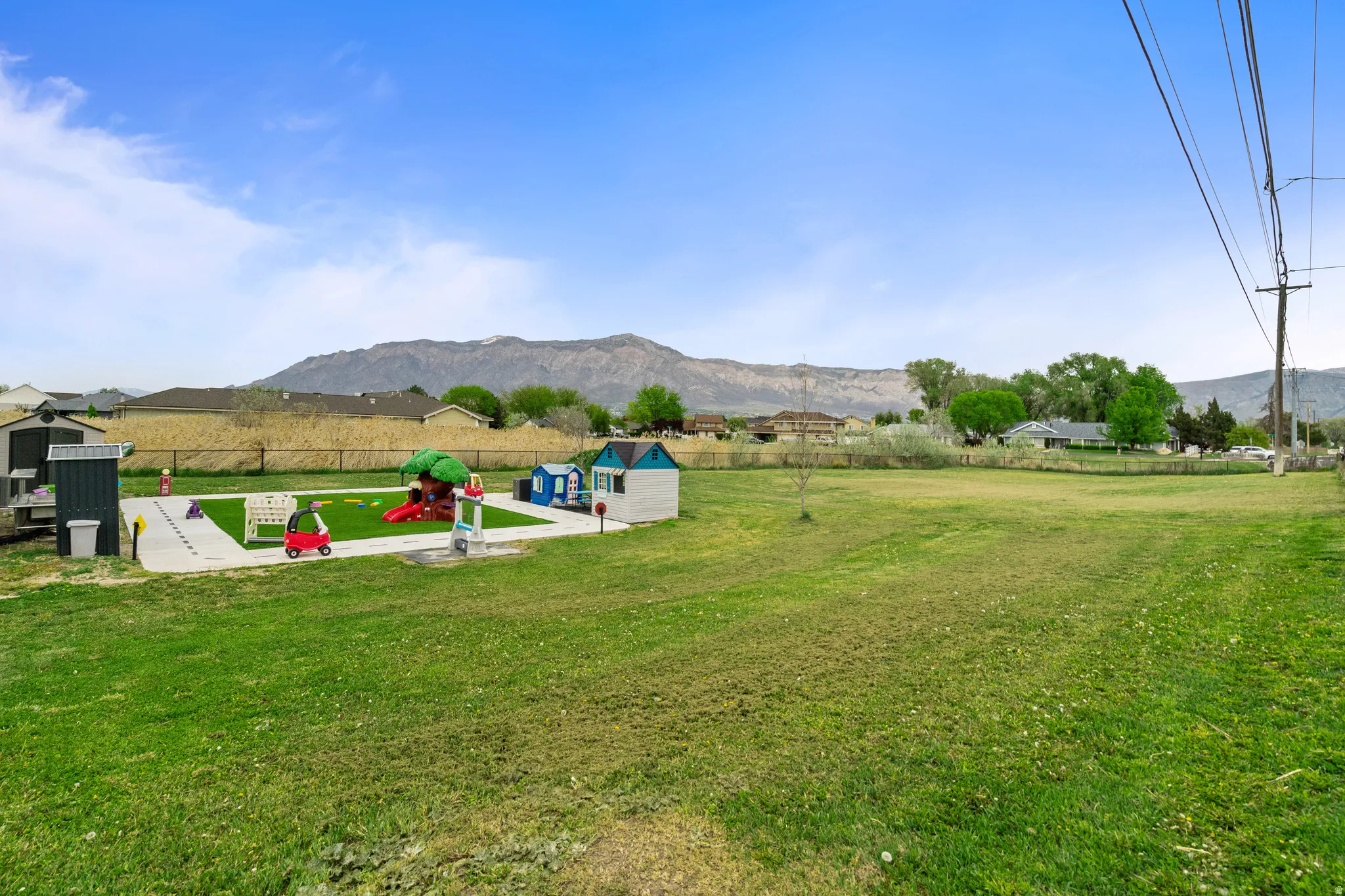 View of yard featuring a mountain view and an outbuilding