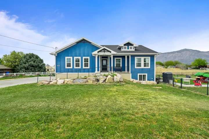 Bungalow-style home with covered porch and board and batten siding