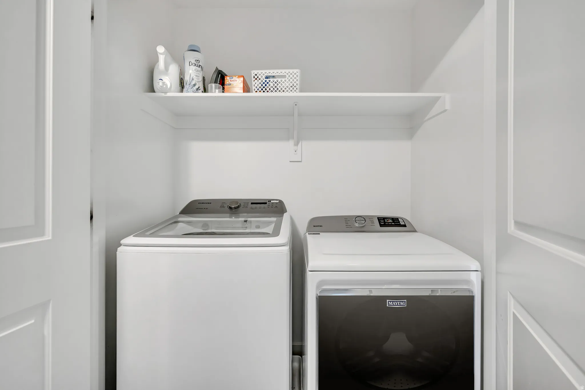 Laundry area with washing machine and dryer.