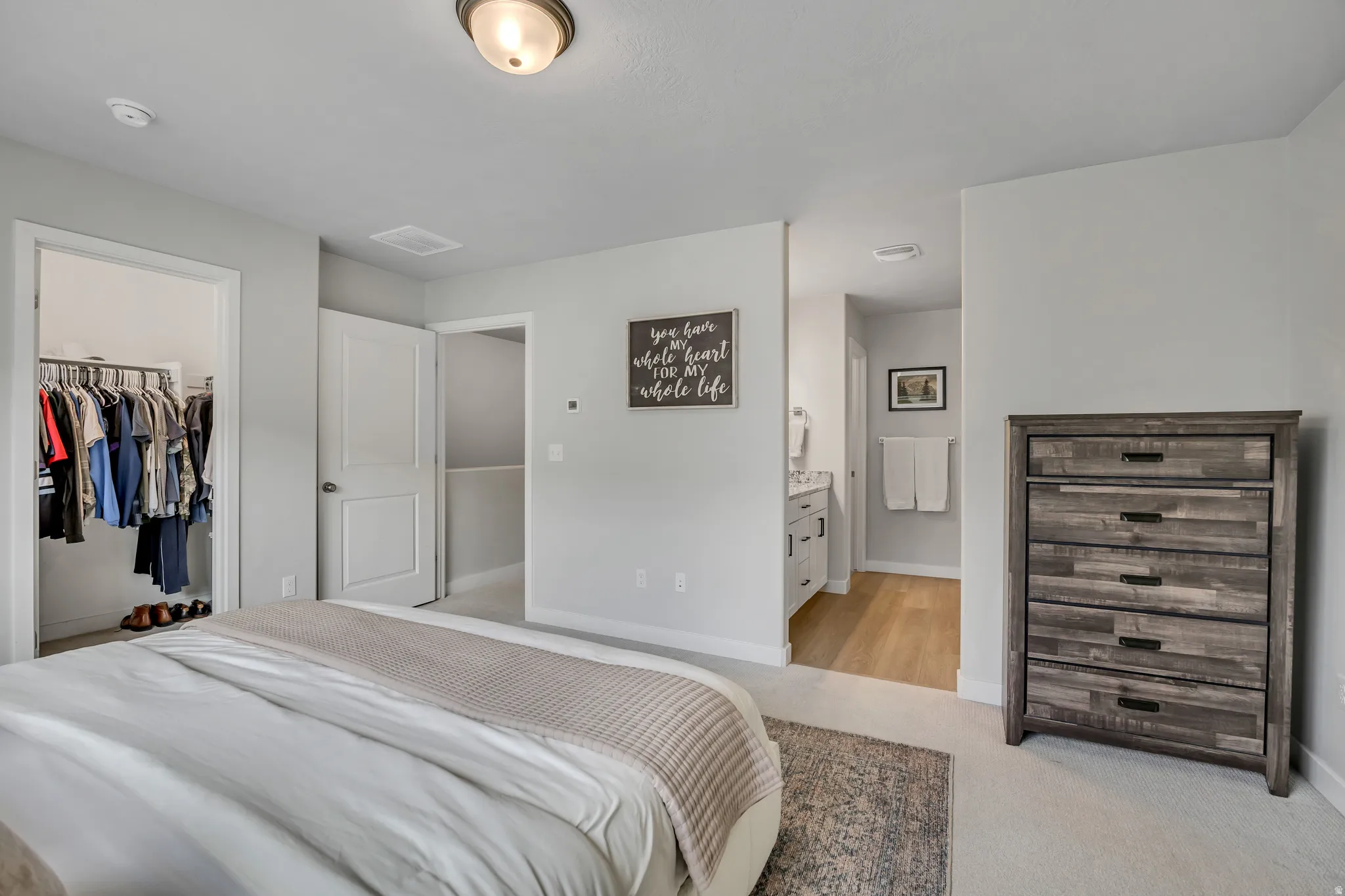 Master/primary bedroom with walk-in closet and bathroom.