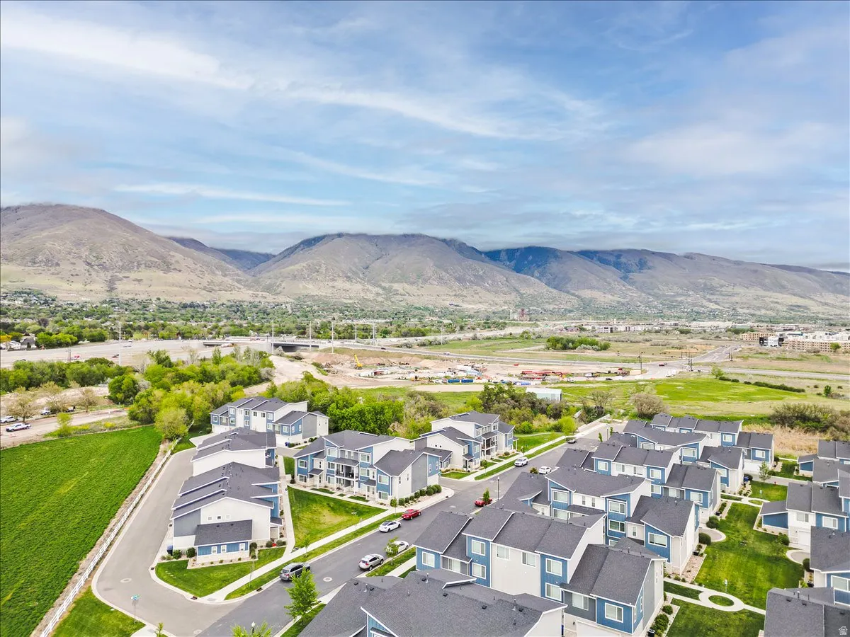 Aerial view of residential area featuring a mountainous background
