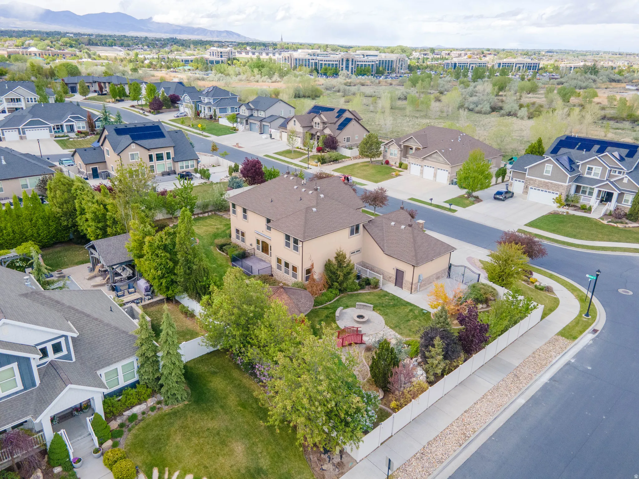 Aerial perspective of suburban area with a mountainous background