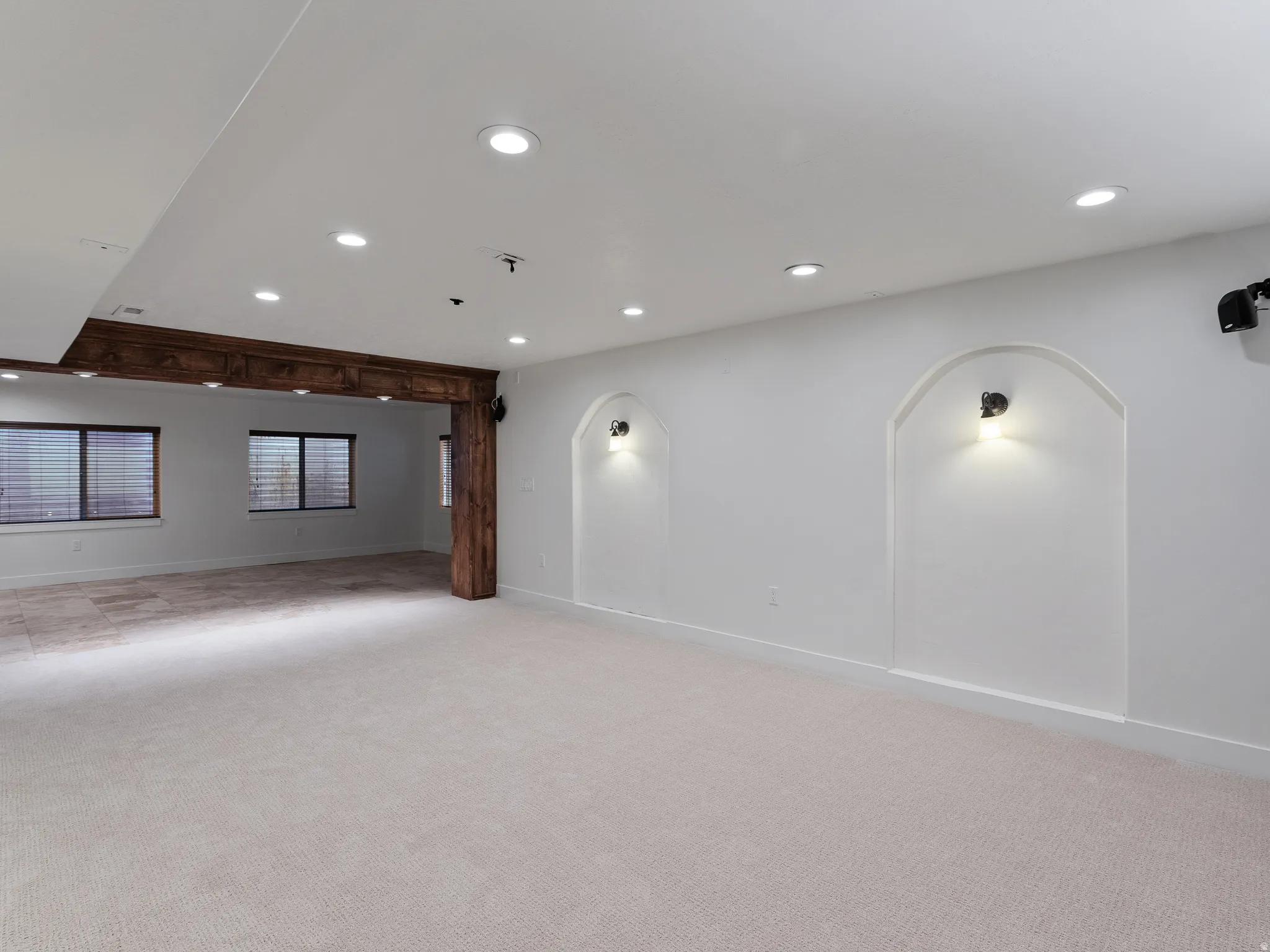 Spare room with recessed lighting and light colored carpet