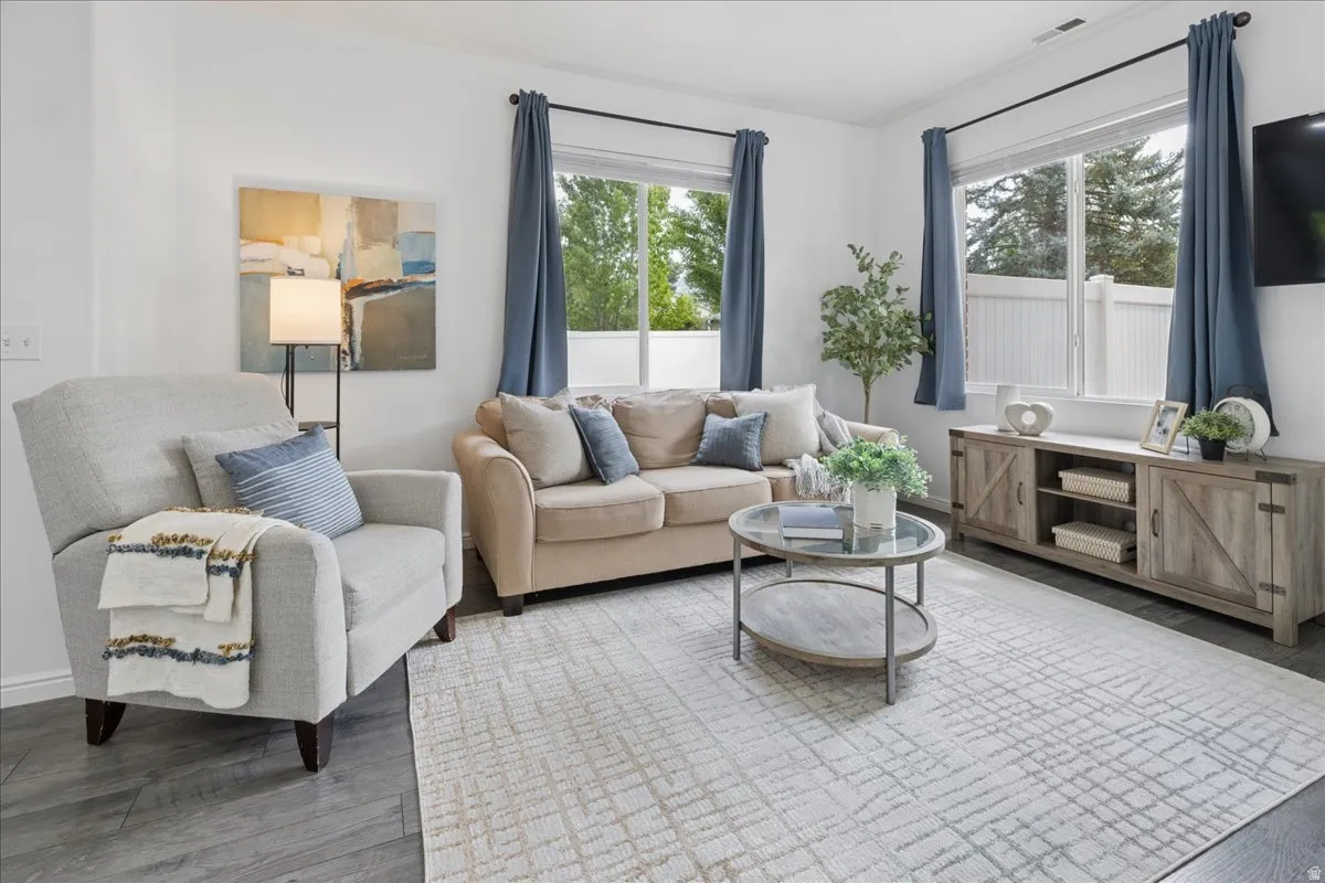 Living room featuring wood finished floors and baseboards