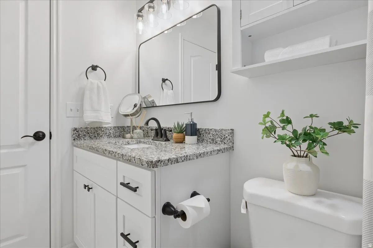 Bathroom with vanity and toilet