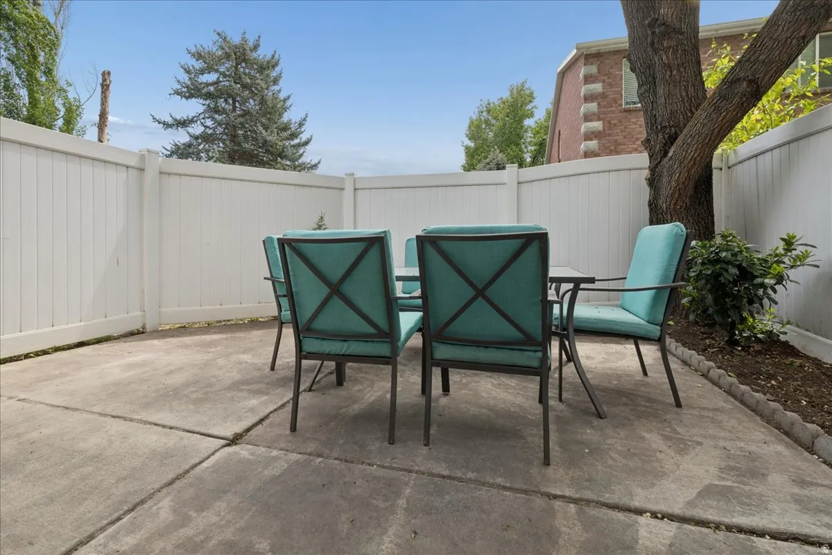 Fenced backyard with a patio and outdoor dining space