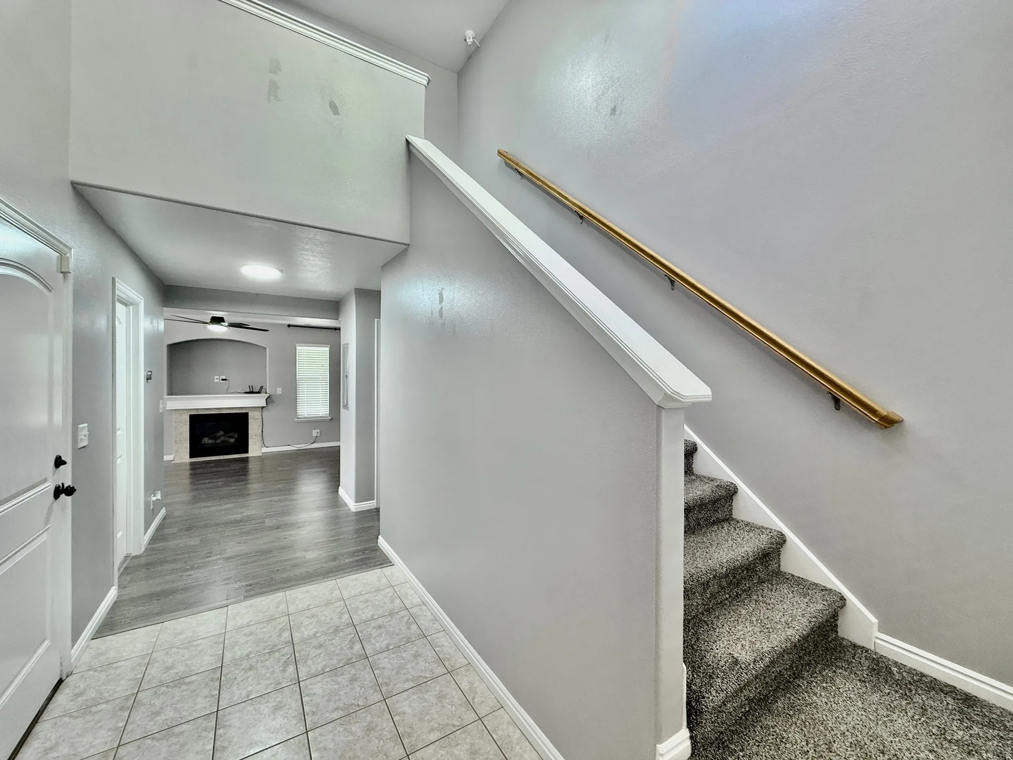 Welcoming entryway featuring tile flooring
