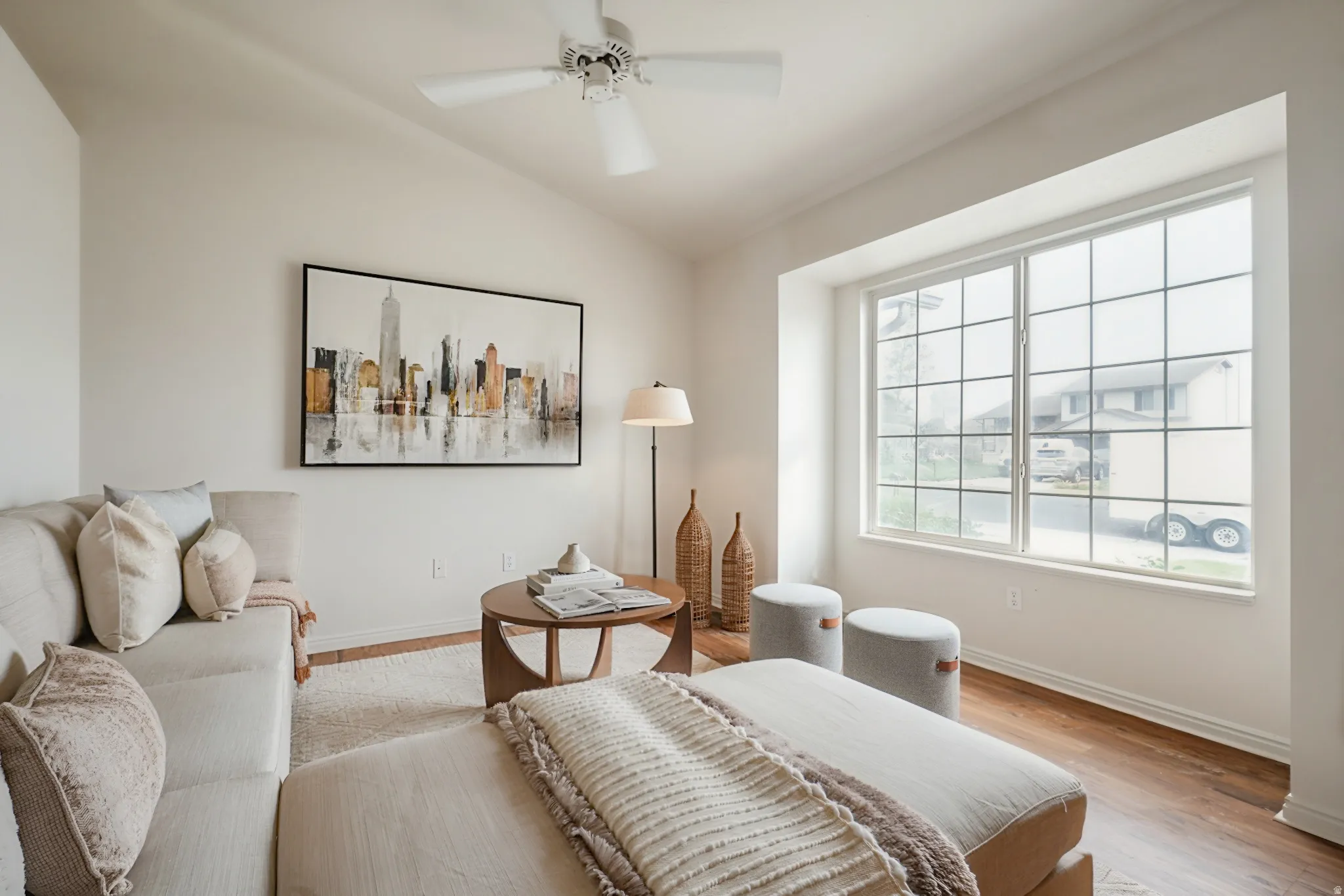 Bedroom with wood finished floors, lofted ceiling, and ceiling fan