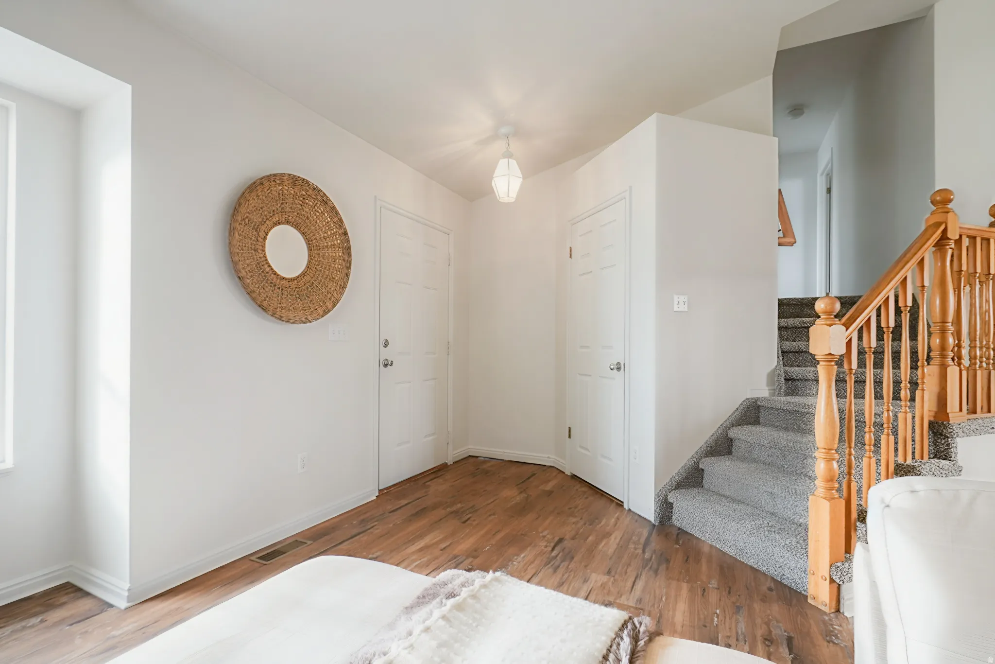 Entrance foyer featuring light wood finished floors