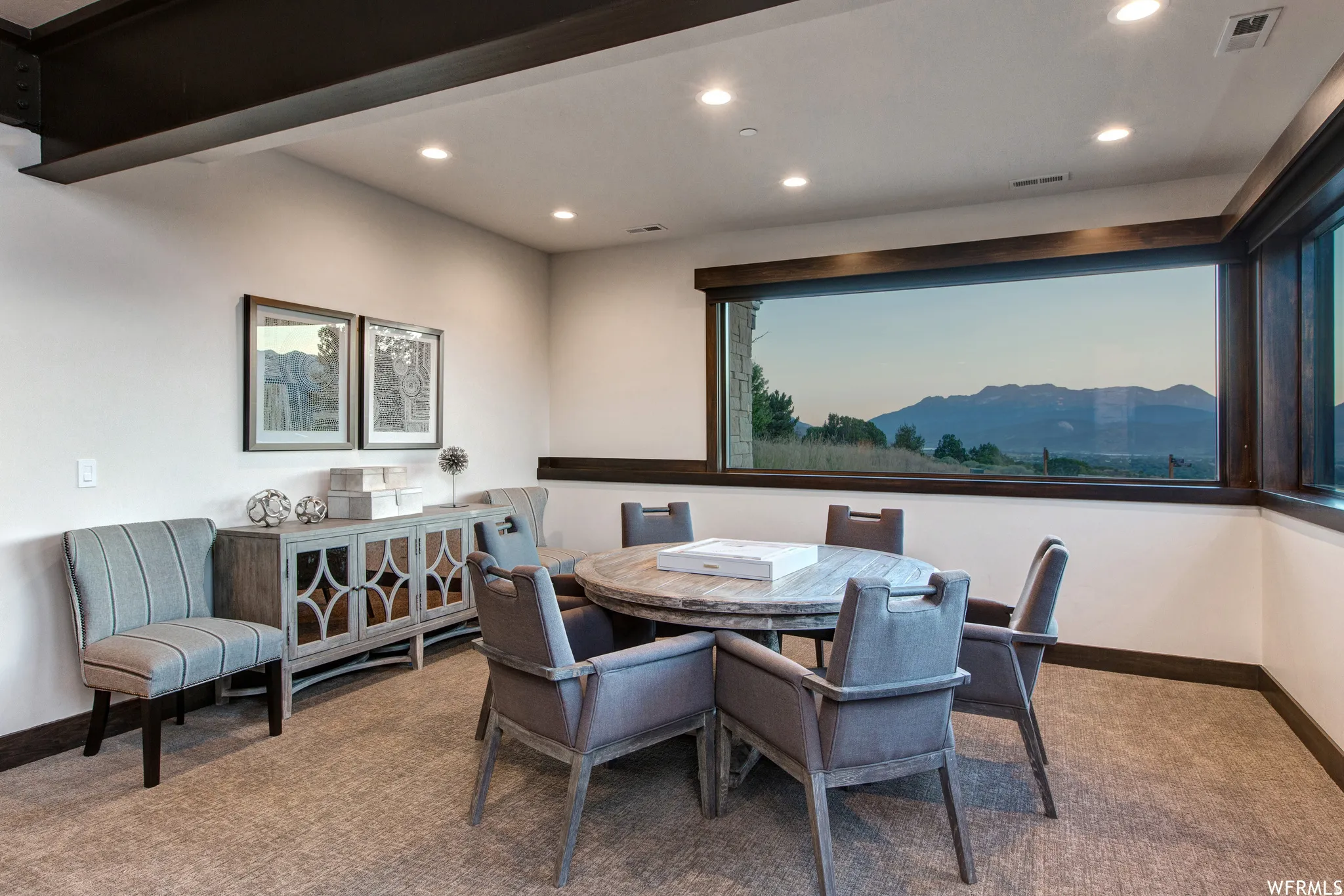 Dining space featuring carpet floors, a mountain view, and recessed lighting