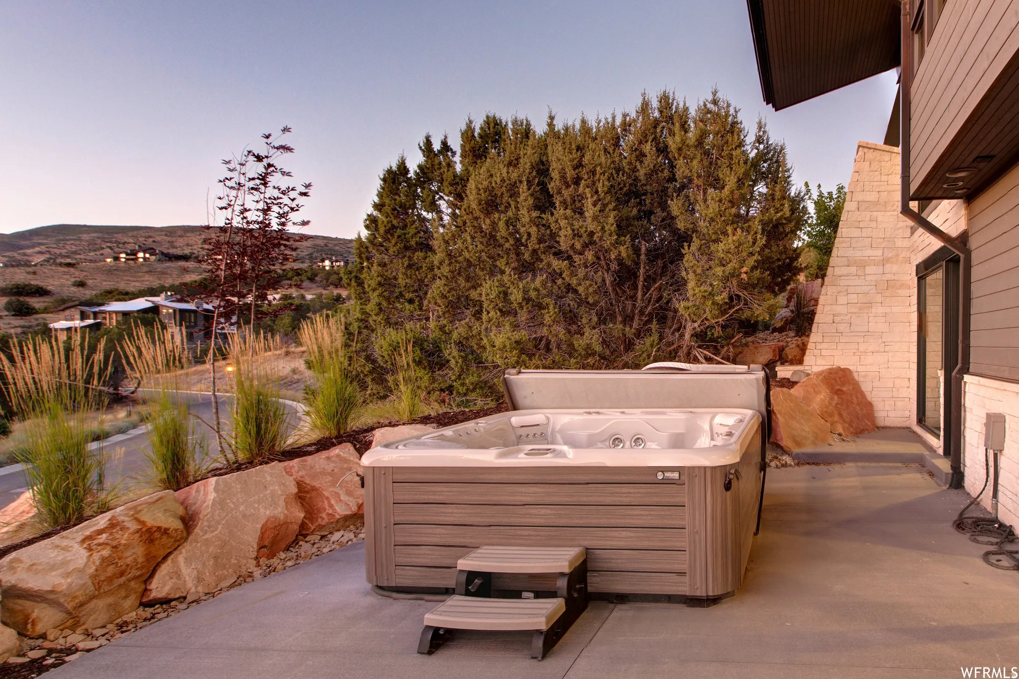 View of patio / terrace featuring a hot tub