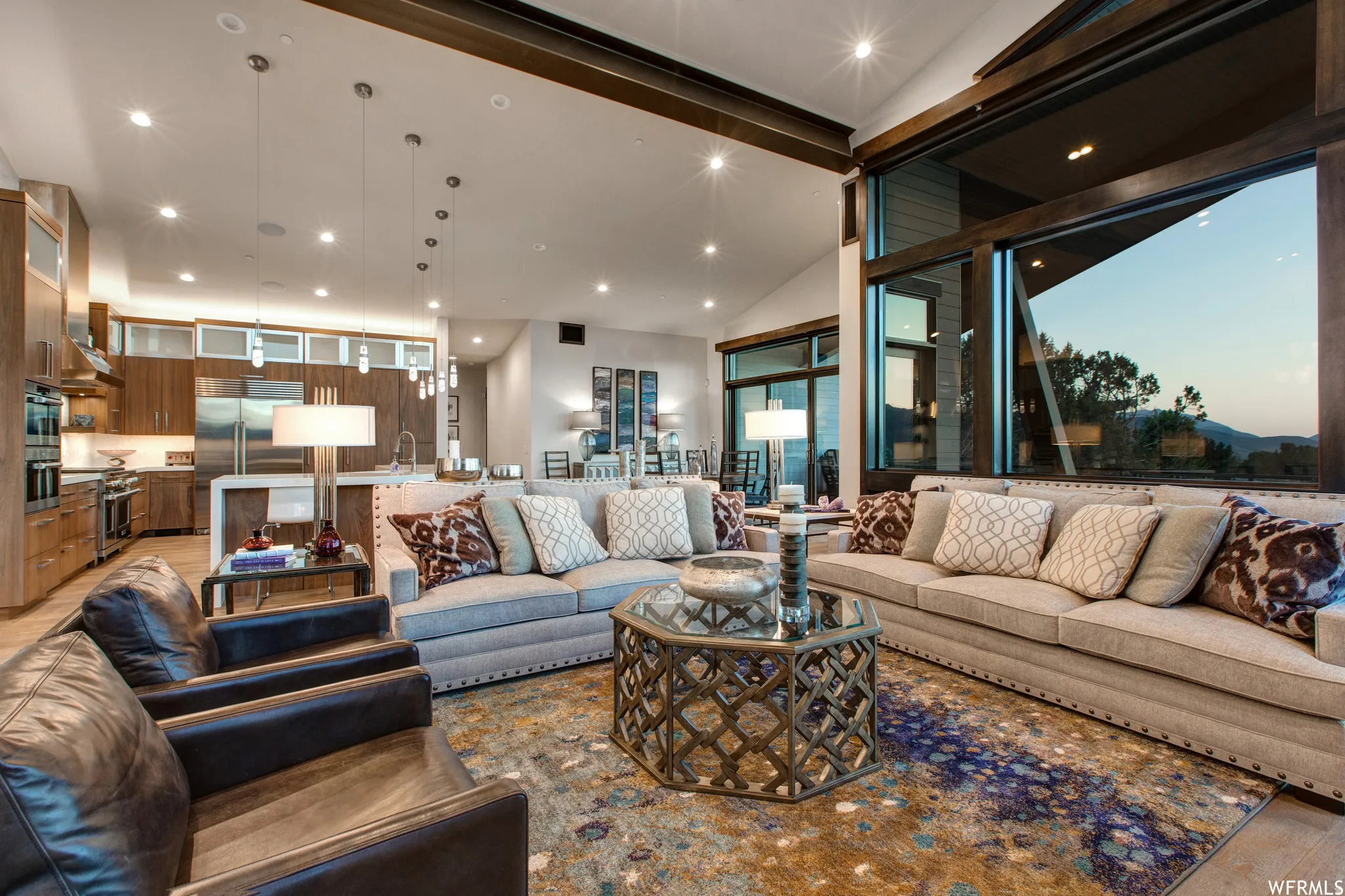 Living room with vaulted ceiling and recessed lighting
