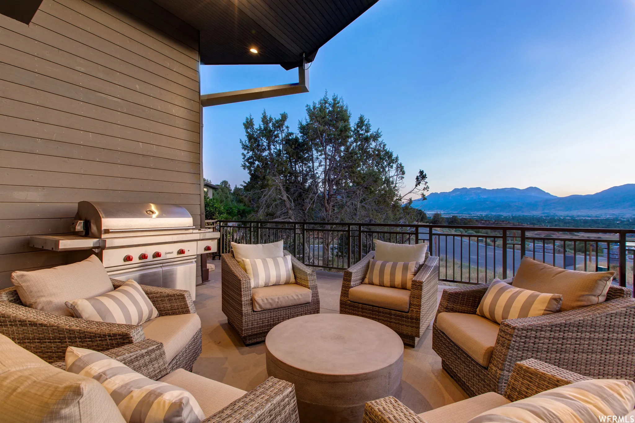 View of patio featuring outdoor lounge area and a mountain view