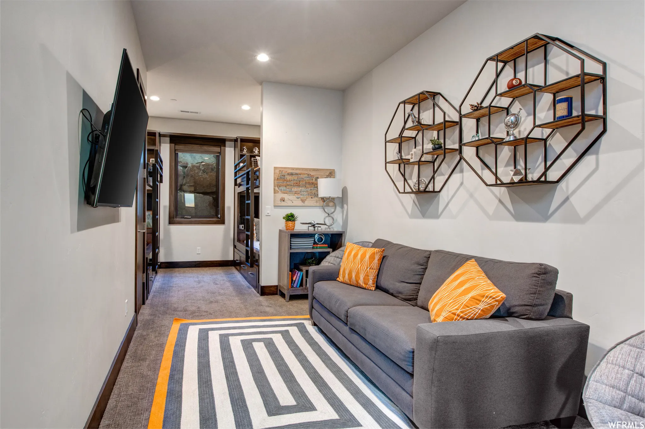 Living area featuring light carpet and recessed lighting