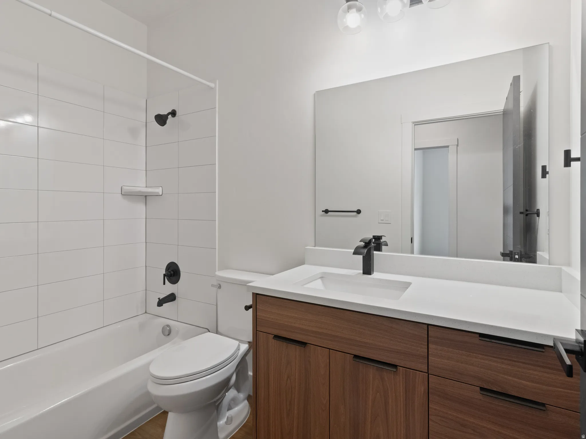 Full bath featuring vanity and tub / shower combination