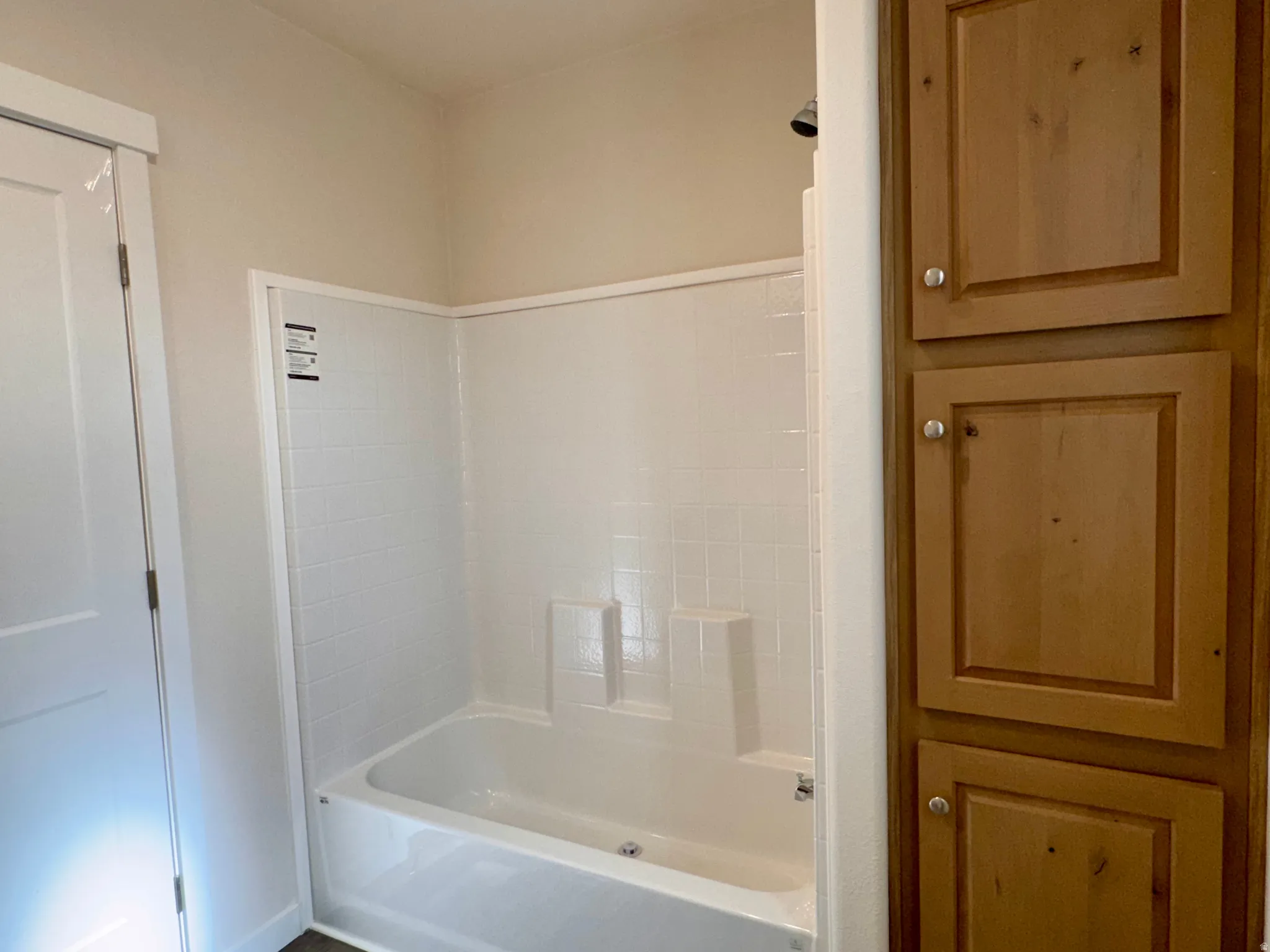 Full bath with storage cabinetry
