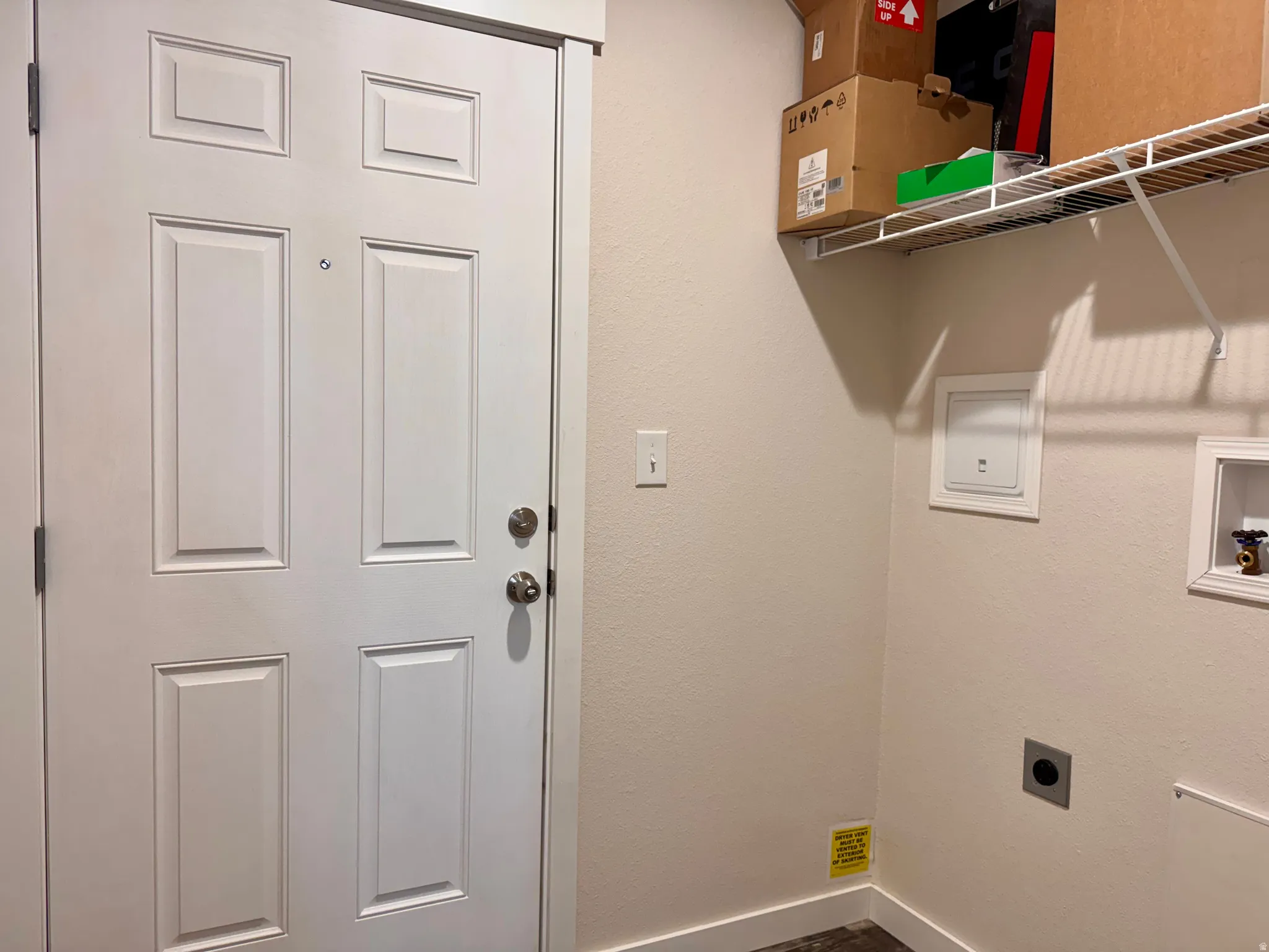 Laundry area with hookup for an electric dryer, washer hookup
