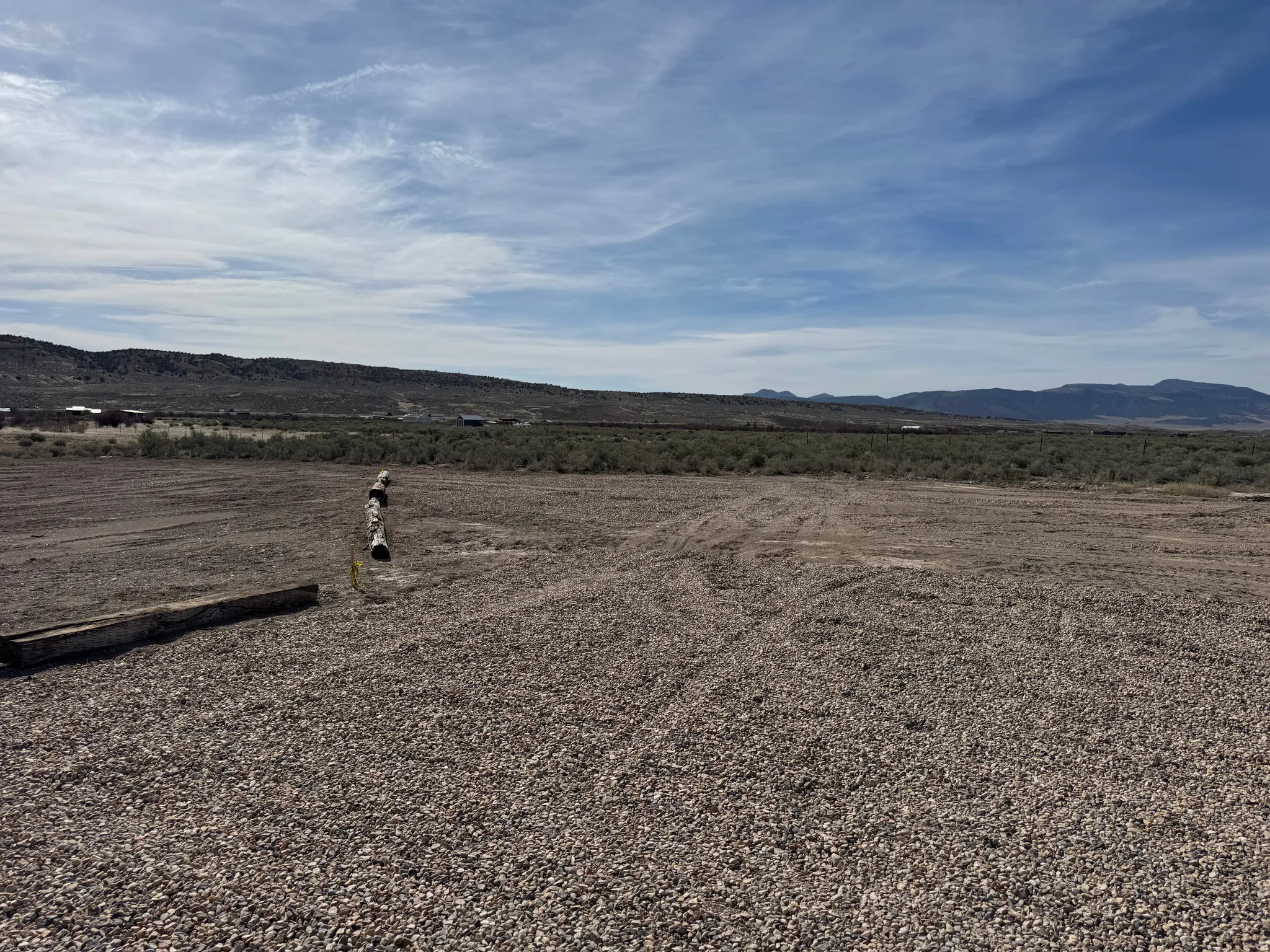 Large gravel parking area.