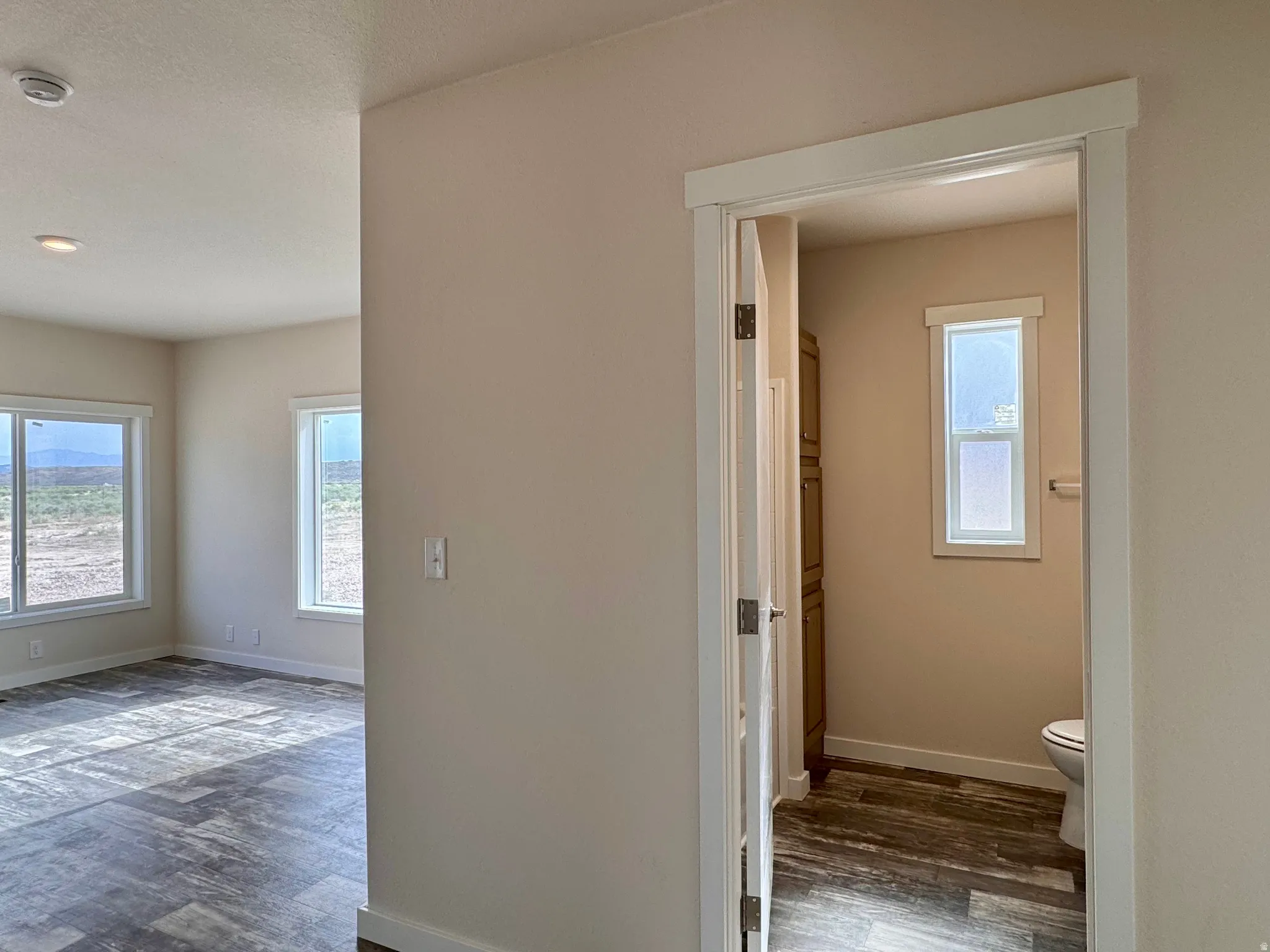 View of the bathroom and living room from the hallway