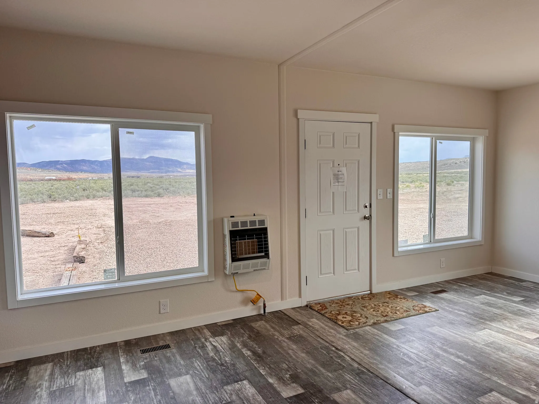 Living room with independent propane wall heater.