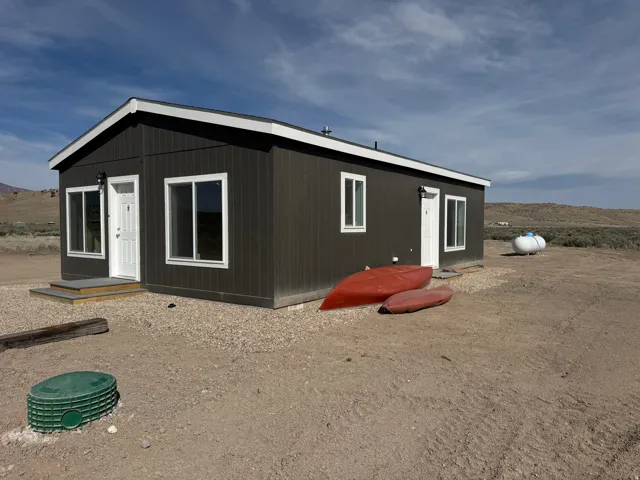 Front and side of home. Canoe and paddle board included.