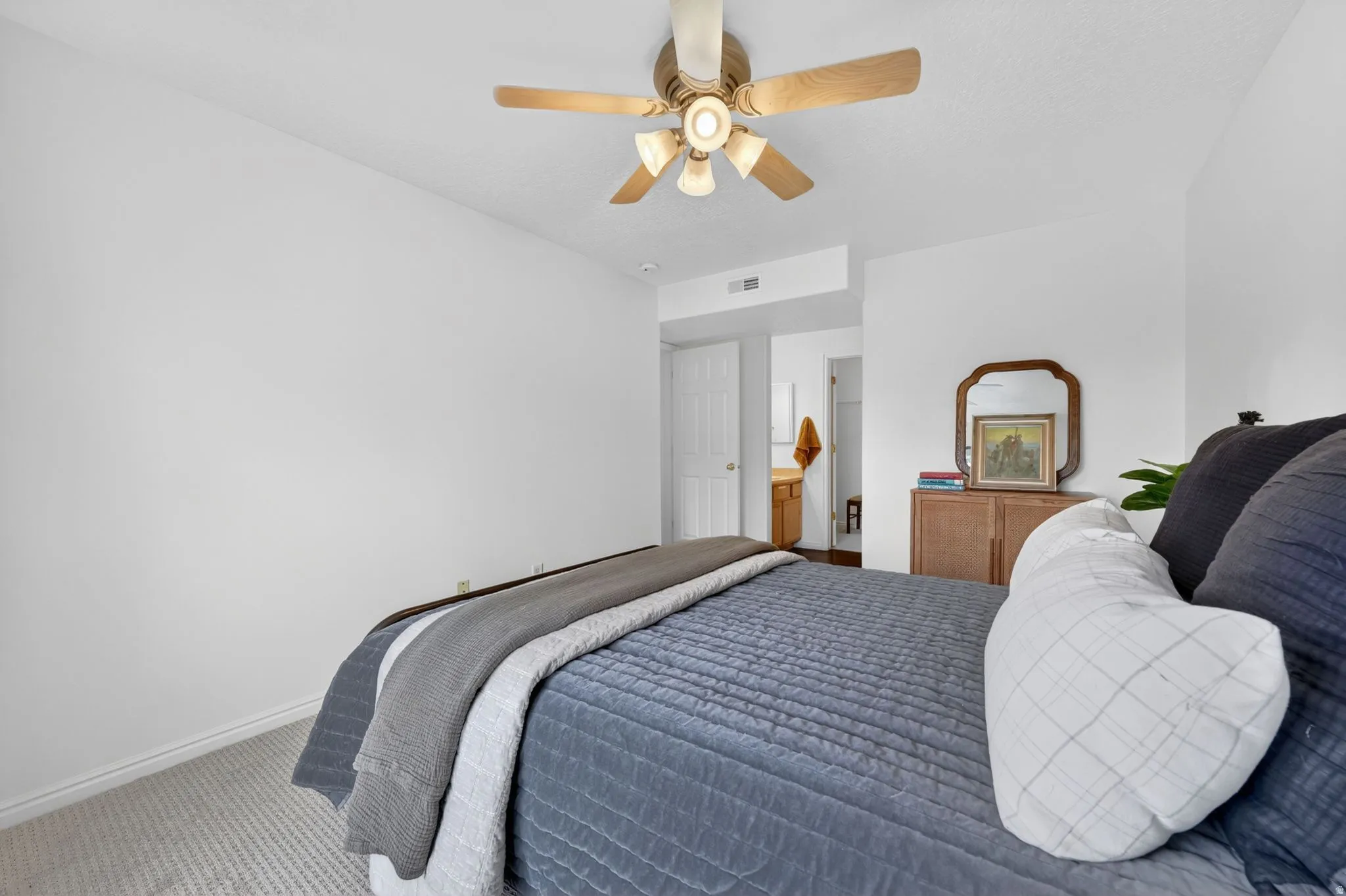 Bedroom featuring carpet and ceiling fan