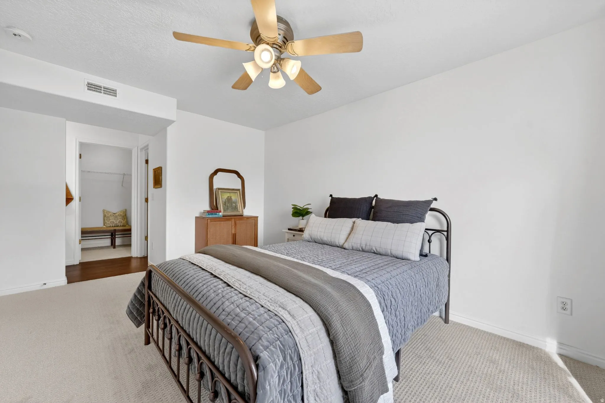 Bedroom with carpet floors and a ceiling fan