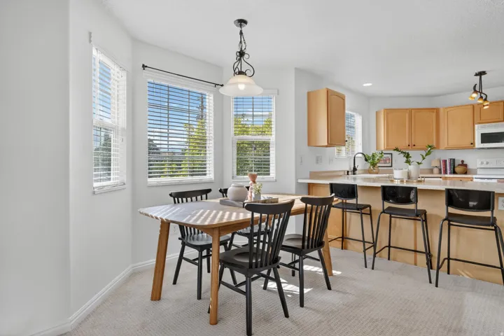 Dining space featuring light carpet and recessed lighting