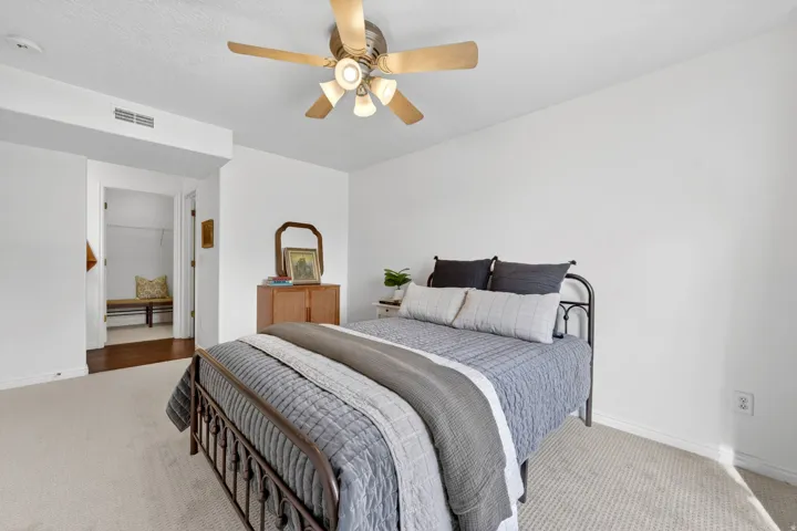 Bedroom with carpet floors and a ceiling fan