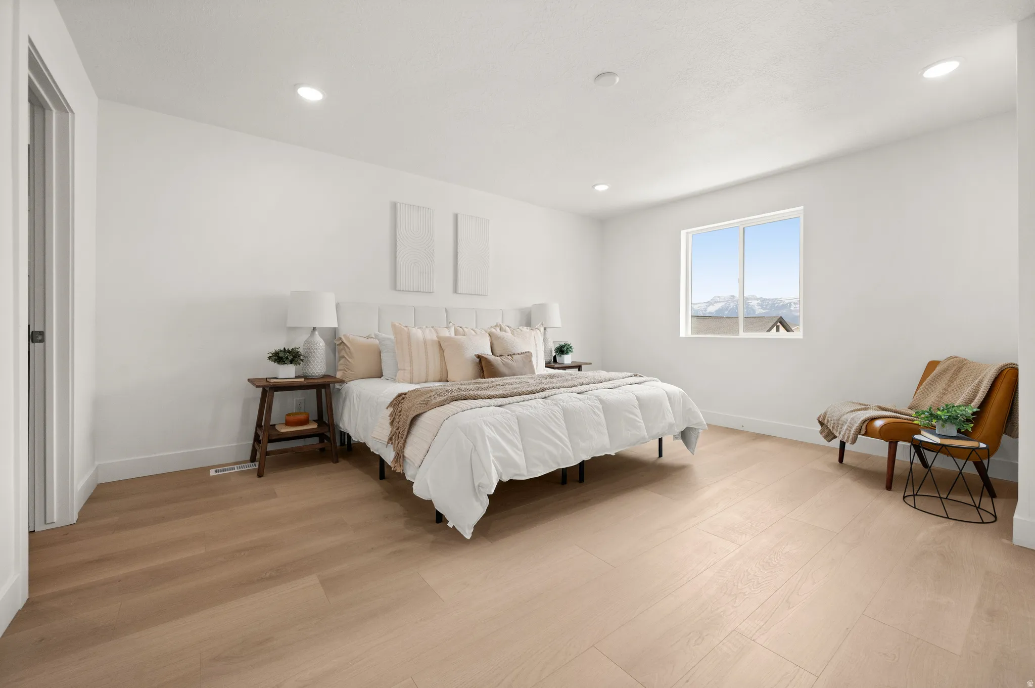 Bedroom featuring light wood-style flooring and recessed lighting