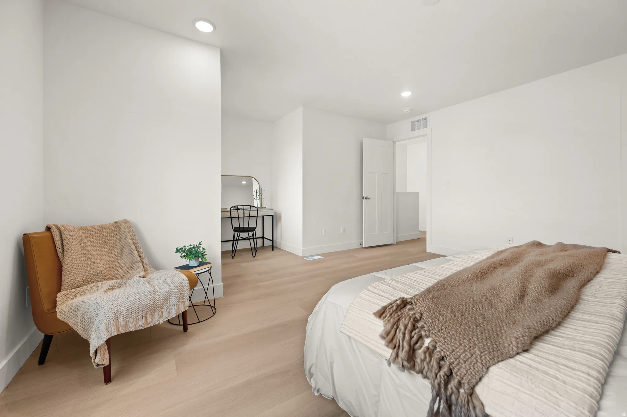 Bedroom featuring light wood finished floors and recessed lighting