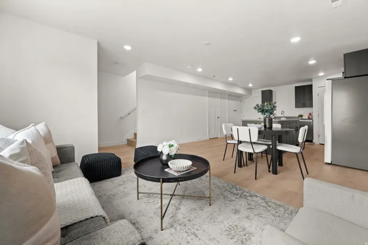 Living room featuring light wood-style flooring and recessed lighting