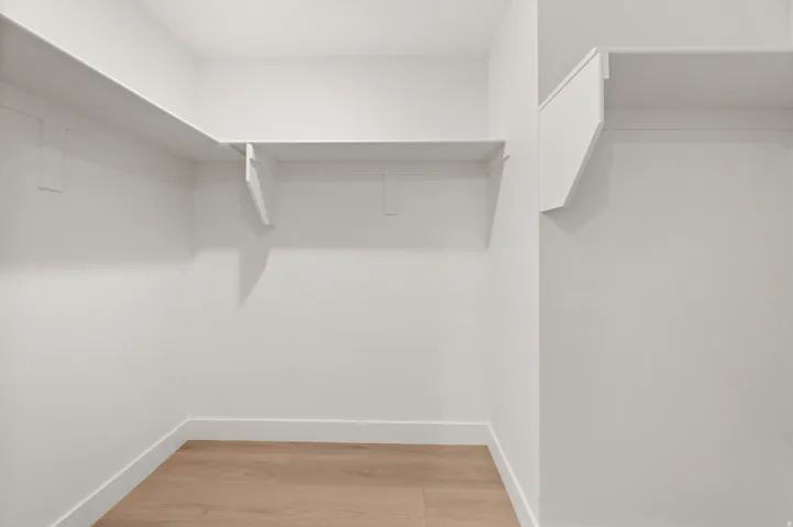 Walk in closet featuring light wood finished floors