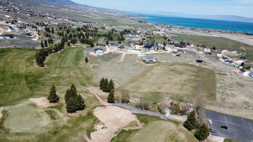 View of property location with a water and mountain view