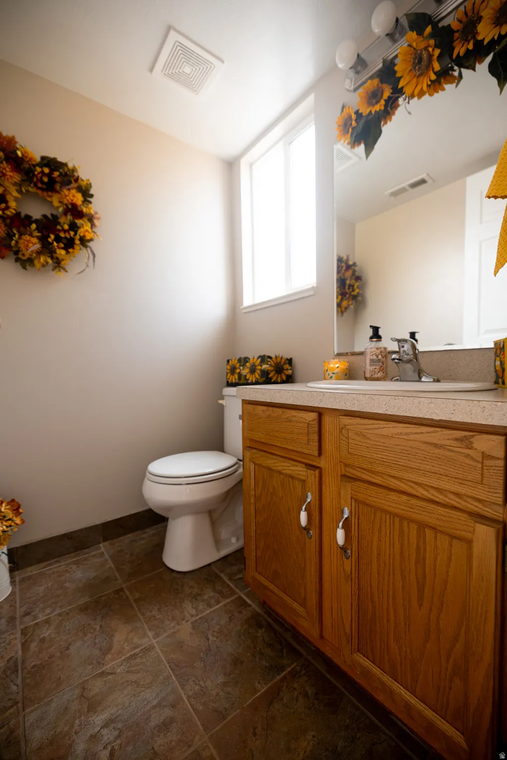 Main floor bathroom featuring vanity and toilet
