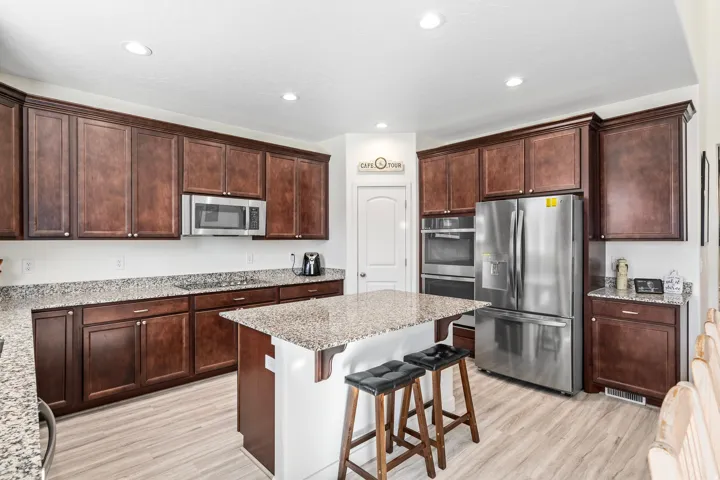 Kitchen with stainless steel appliances, double oven