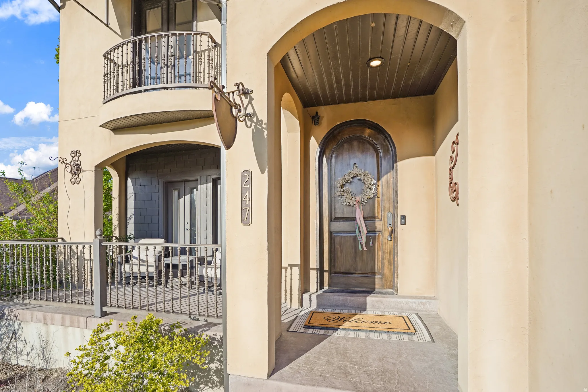 Entrance to property with stucco siding