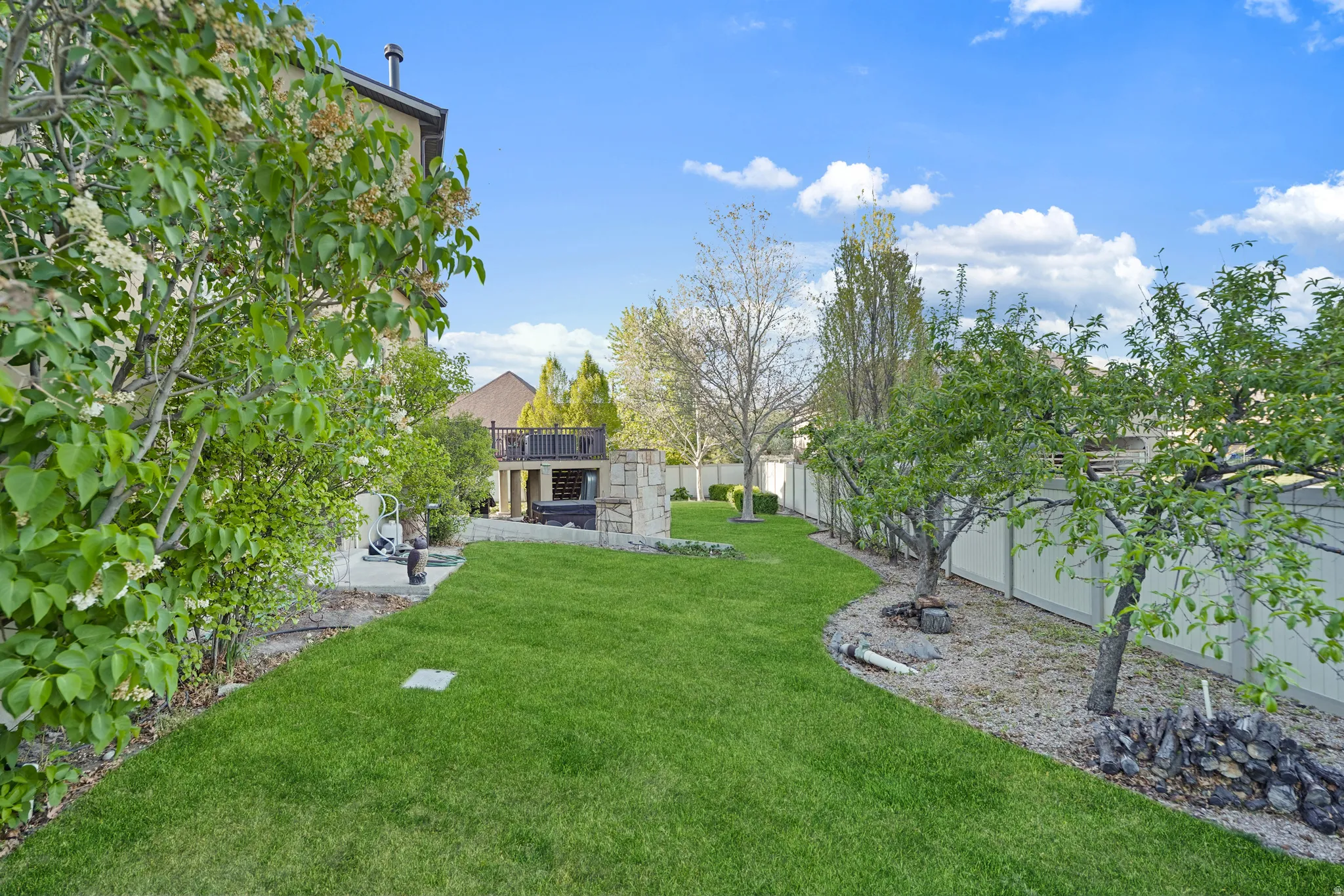 Fenced backyard with a patio