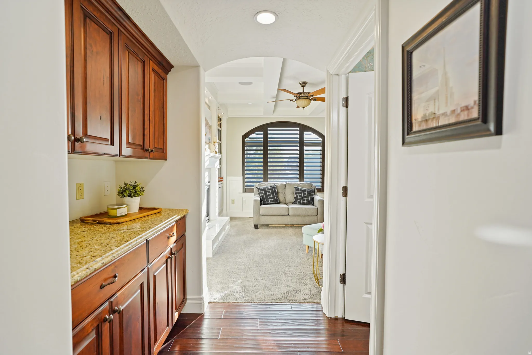Corridor featuring wood tiled floors, dark colored carpet, and recessed lighting