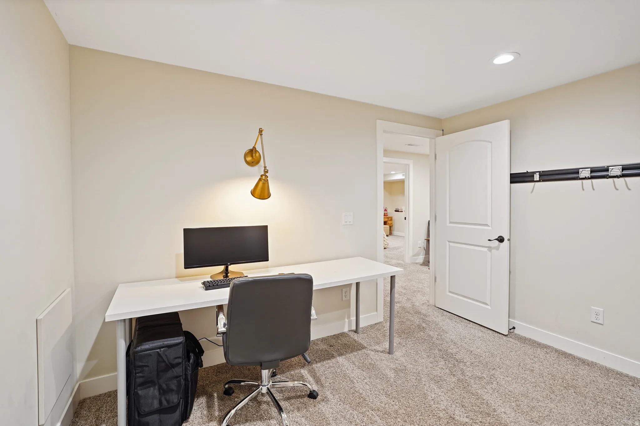 Home office featuring light colored carpet and recessed lighting