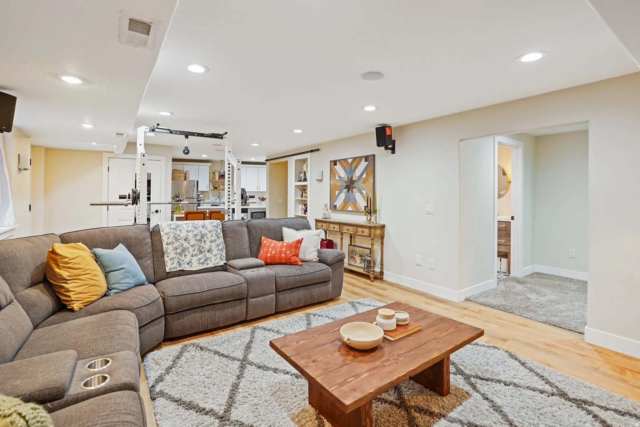 Living room featuring light wood finished floors and recessed lighting