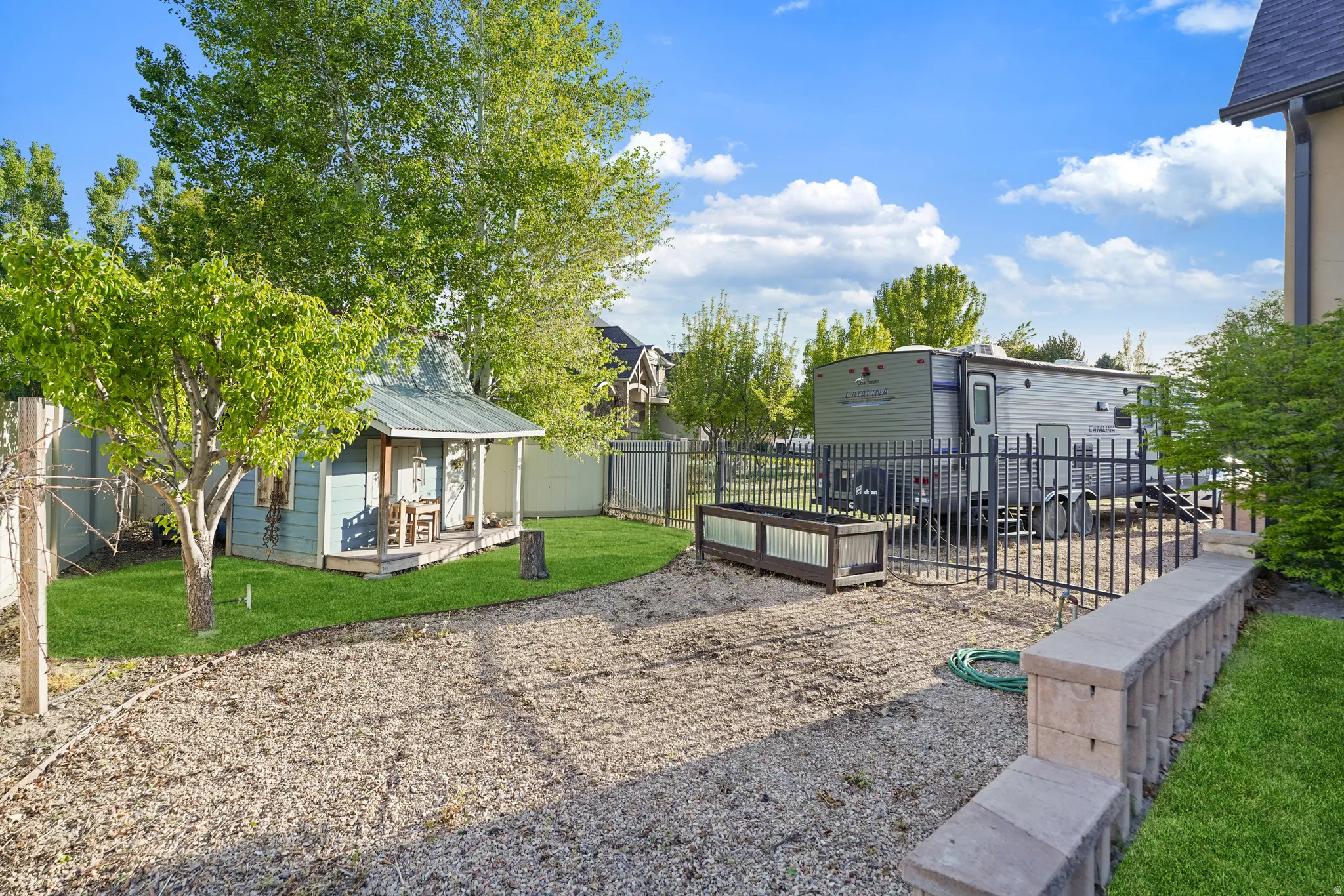 View of fenced backyard